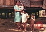 Image of native village Pacific Theater, 1944, second 42 stock footage video 65675065674