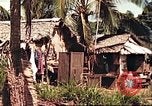 Image of native village Pacific Theater, 1944, second 44 stock footage video 65675065674