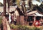 Image of native village Pacific Theater, 1944, second 45 stock footage video 65675065674