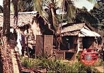 Image of native village Pacific Theater, 1944, second 46 stock footage video 65675065674