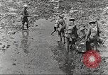 Image of British soldiers in muddy battle in World War 1 France, 1916, second 4 stock footage video 65675066066