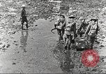 Image of British soldiers in muddy battle in World War 1 France, 1916, second 5 stock footage video 65675066066