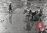 Image of British soldiers in muddy battle in World War 1 France, 1916, second 6 stock footage video 65675066066
