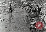 Image of British soldiers in muddy battle in World War 1 France, 1916, second 8 stock footage video 65675066066