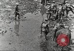 Image of British soldiers in muddy battle in World War 1 France, 1916, second 11 stock footage video 65675066066