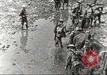 Image of British soldiers in muddy battle in World War 1 France, 1916, second 13 stock footage video 65675066066