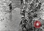 Image of British soldiers in muddy battle in World War 1 France, 1916, second 14 stock footage video 65675066066