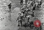 Image of British soldiers in muddy battle in World War 1 France, 1916, second 15 stock footage video 65675066066