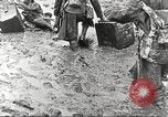 Image of British soldiers in muddy battle in World War 1 France, 1916, second 21 stock footage video 65675066066