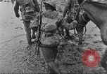 Image of British soldiers in muddy battle in World War 1 France, 1916, second 26 stock footage video 65675066066