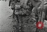 Image of British soldiers in muddy battle in World War 1 France, 1916, second 27 stock footage video 65675066066