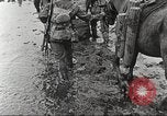 Image of British soldiers in muddy battle in World War 1 France, 1916, second 28 stock footage video 65675066066