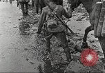 Image of British soldiers in muddy battle in World War 1 France, 1916, second 33 stock footage video 65675066066
