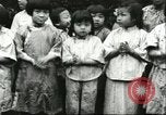 Image of poor children China, 1932, second 25 stock footage video 65675066269
