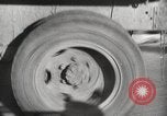 Image of tire remover United States USA, 1947, second 32 stock footage video 65675066620