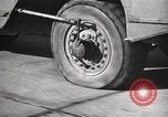 Image of tire remover United States USA, 1947, second 44 stock footage video 65675066620