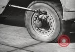 Image of tire remover United States USA, 1947, second 47 stock footage video 65675066620