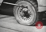 Image of tire remover United States USA, 1947, second 48 stock footage video 65675066620