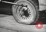 Image of tire remover United States USA, 1947, second 52 stock footage video 65675066620