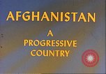 Image of Camel caravan silhouetted against the sky at dawn Afghanistan, 1960, second 15 stock footage video 65675066733