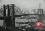 Image of Brooklyn Bridge and Williamsburg Bridge New York City USA, 1918, second 25 stock footage video 65675066758