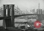Image of Brooklyn Bridge and Williamsburg Bridge New York City USA, 1918, second 26 stock footage video 65675066758
