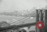 Image of Brooklyn Bridge and Williamsburg Bridge New York City USA, 1918, second 27 stock footage video 65675066758