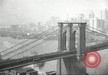 Image of Brooklyn Bridge and Williamsburg Bridge New York City USA, 1918, second 32 stock footage video 65675066758