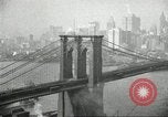 Image of Brooklyn Bridge and Williamsburg Bridge New York City USA, 1918, second 36 stock footage video 65675066758