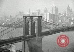 Image of Brooklyn Bridge and Williamsburg Bridge New York City USA, 1918, second 37 stock footage video 65675066758