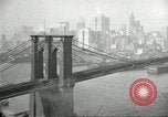 Image of Brooklyn Bridge and Williamsburg Bridge New York City USA, 1918, second 40 stock footage video 65675066758