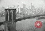 Image of Brooklyn Bridge and Williamsburg Bridge New York City USA, 1918, second 42 stock footage video 65675066758