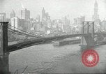 Image of Brooklyn Bridge and Williamsburg Bridge New York City USA, 1918, second 48 stock footage video 65675066758