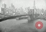Image of Brooklyn Bridge and Williamsburg Bridge New York City USA, 1918, second 51 stock footage video 65675066758