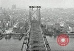 Image of Brooklyn Bridge and Williamsburg Bridge New York City USA, 1918, second 52 stock footage video 65675066758