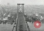 Image of Brooklyn Bridge and Williamsburg Bridge New York City USA, 1918, second 53 stock footage video 65675066758