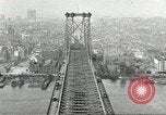 Image of Brooklyn Bridge and Williamsburg Bridge New York City USA, 1918, second 54 stock footage video 65675066758