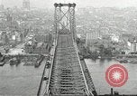 Image of Brooklyn Bridge and Williamsburg Bridge New York City USA, 1918, second 56 stock footage video 65675066758