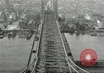 Image of Brooklyn Bridge and Williamsburg Bridge New York City USA, 1918, second 59 stock footage video 65675066758
