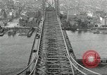 Image of Brooklyn Bridge and Williamsburg Bridge New York City USA, 1918, second 60 stock footage video 65675066758