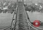 Image of Brooklyn Bridge and Williamsburg Bridge New York City USA, 1918, second 61 stock footage video 65675066758