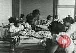 Image of African American women students sewing Charlotte North Carolina USA, 1937, second 15 stock footage video 65675066786