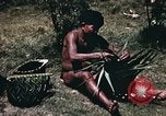 Image of native man Pacific Theater, 1945, second 5 stock footage video 65675067201