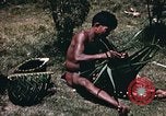 Image of native man Pacific Theater, 1945, second 6 stock footage video 65675067201