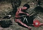 Image of native man Pacific Theater, 1945, second 7 stock footage video 65675067201