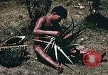 Image of native man Pacific Theater, 1945, second 9 stock footage video 65675067201