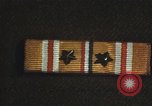 Image of medals on coat Mariana Islands, 1945, second 31 stock footage video 65675067213
