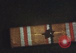 Image of medals on coat Mariana Islands, 1945, second 44 stock footage video 65675067213