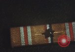 Image of medals on coat Mariana Islands, 1945, second 45 stock footage video 65675067213