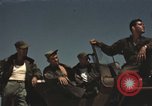 Image of men on jeep Mariana Islands, 1945, second 9 stock footage video 65675067214